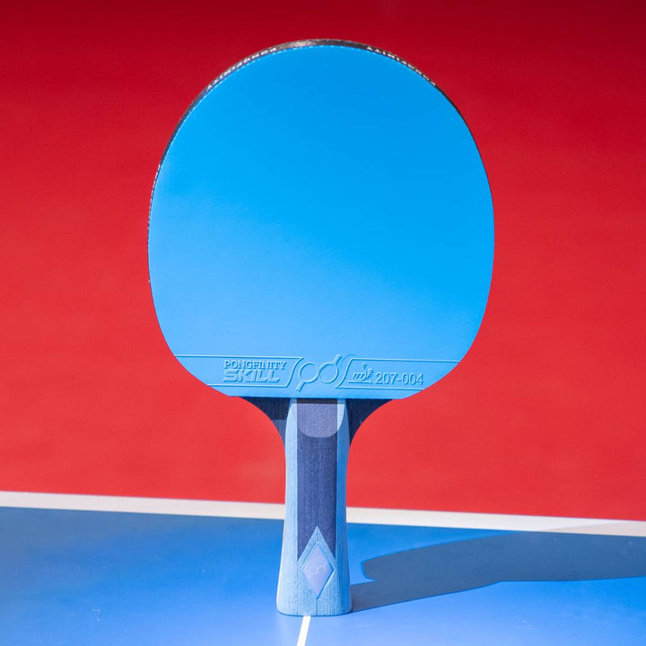 The blue Skill racket on the table